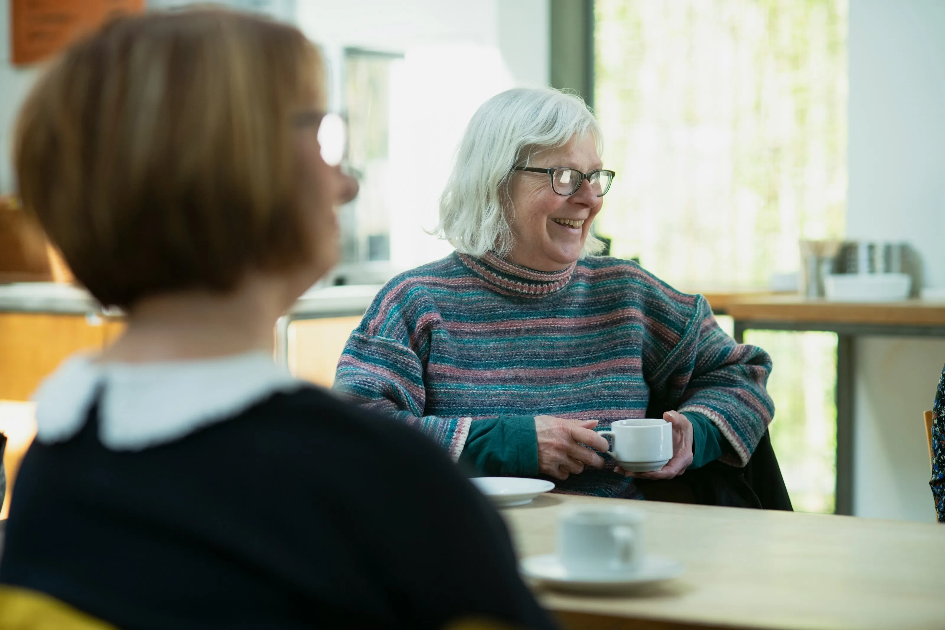 Two women talking over a cup of tea