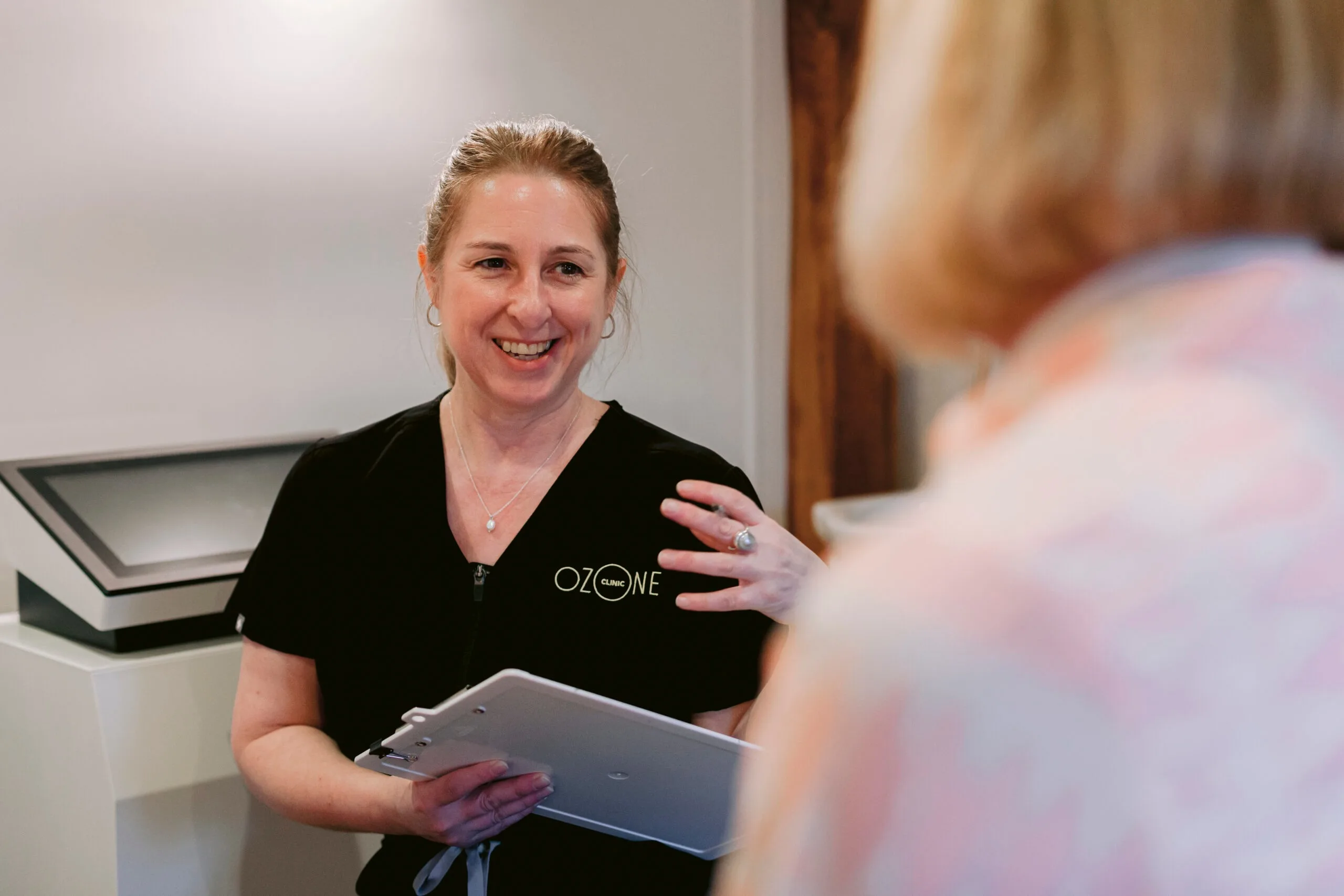 Laura Dinham talking through results with a client