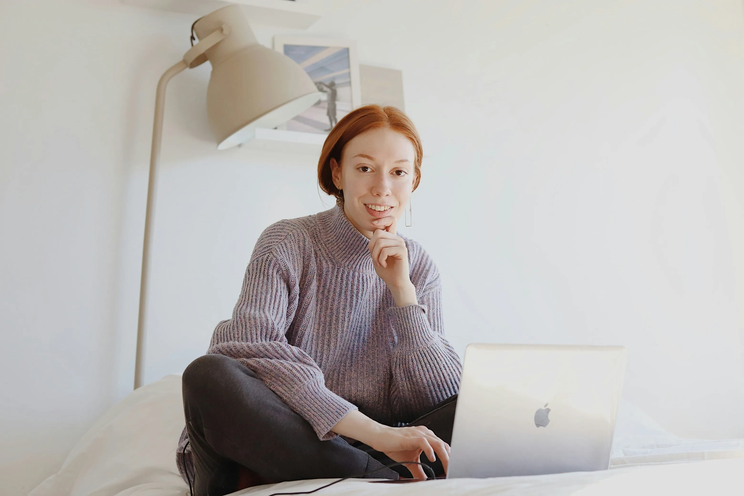 A woman at home joining a video consultation on her laptop