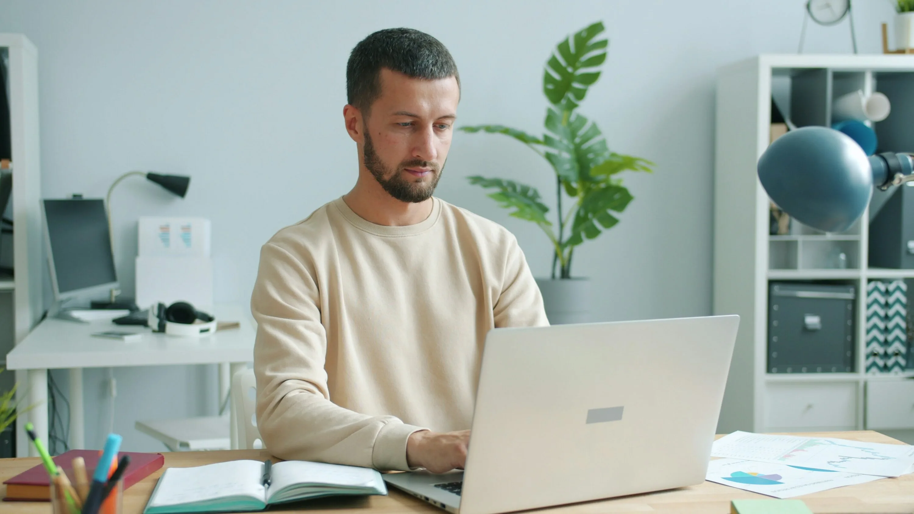 A man at home at his laptop, ready for his results review